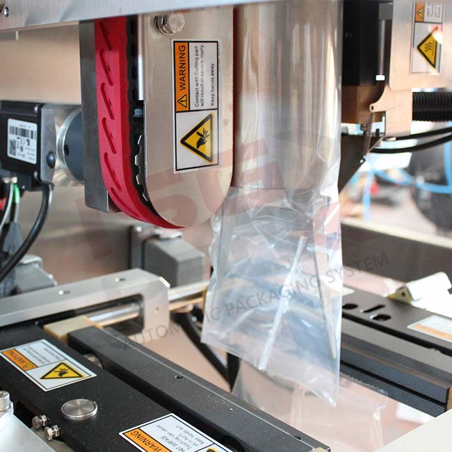 2 - sistema-di-trascinamento-prodotto-macchina-verticale